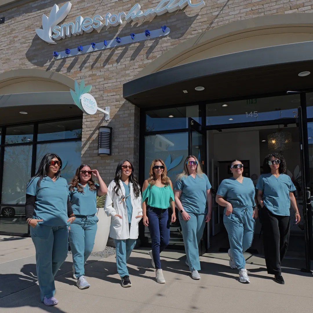 The Smiles for Health team walking out of the Gateway Road office in Carlsbad