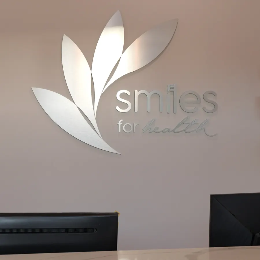 The calm reception area with the Smiles for Health leaf logo